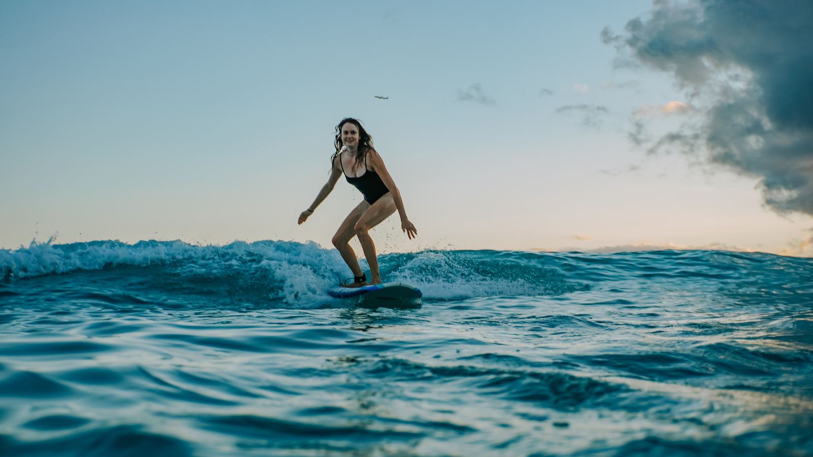 Surfer with Diamond Head crater in the background